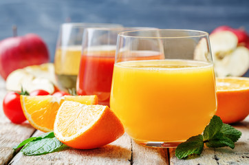 set of juices: orange, tomato and apple