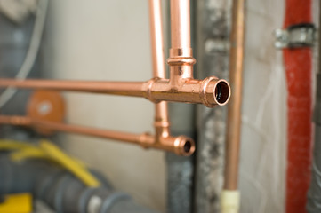 Fototapeta na wymiar Copper water pipes