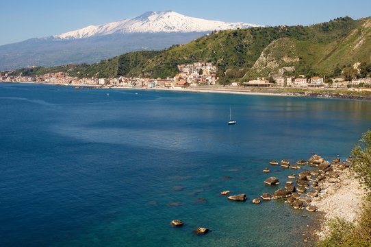 The bay of Giardini Naxos and volcano Etna from Taormina, Sicily, Italy