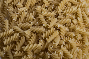 Italian Penne Rigate Macaroni Pasta raw food background or textu