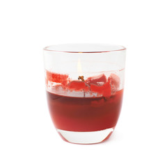Half-burned lit red candle isolated