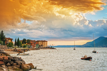 Scenic view of sunset at Lake Garda in the evening, Veneto, Italy - obrazy, fototapety, plakaty