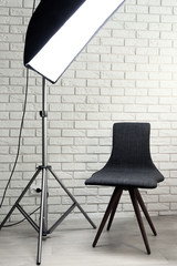 Photo studio with modern interior and lighting equipment
