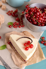 Tasty cheesecake with berries on table close up