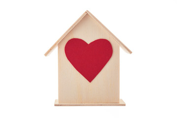 Wooden house with little heart on white background