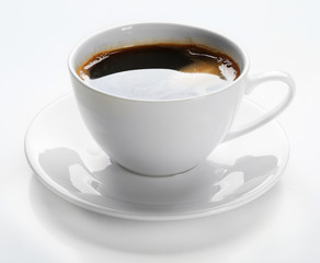 A cup of tasty coffee, isolated on white