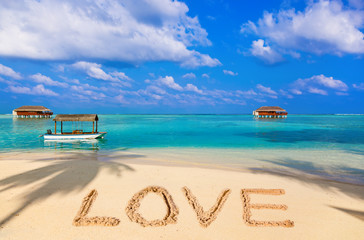 Fototapeta na wymiar Word Love on beach