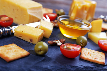 Cheese for tasting on a mat closeup