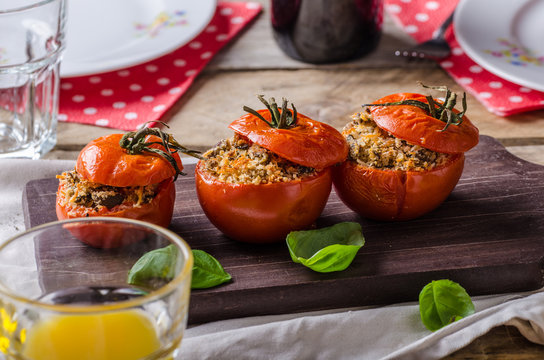 Baked tomatoes stuffed with herbs