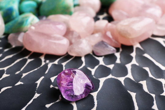 Beautiful mineral stones on grey surface