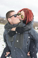 Fototapeta na wymiar girlfriend kissing a boyfriend on the cheek