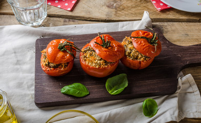 Baked tomatoes stuffed with herbs - obrazy, fototapety, plakaty