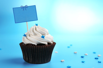 Chocolate cupcake on blurred background