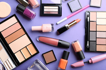 Cosmetics set on purple background