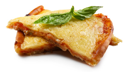 Tasty slices of pizza with basil isolated on white.
