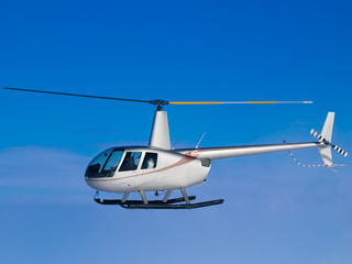 Helicopter flying in blue sky side view - obrazy, fototapety, plakaty