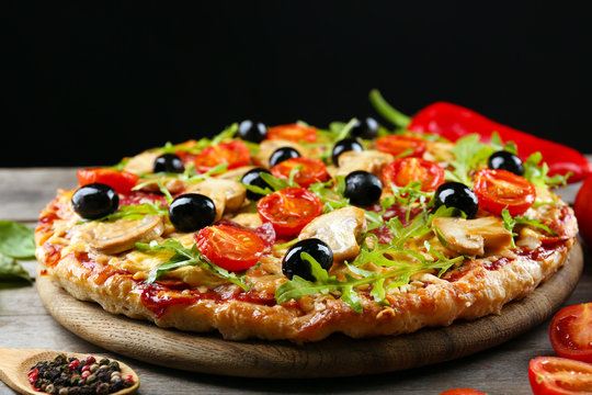 Delicious Tasty Pizza On Black Background