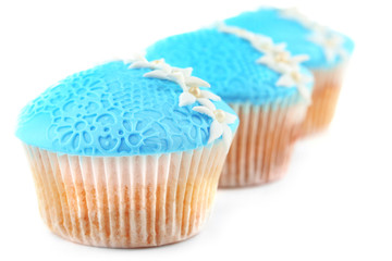 Blue cupcakes isolated on white