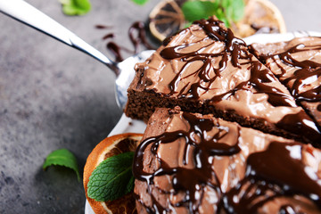 Sliced chocolate pie with mint, closeup