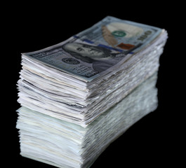 Stack of dollar banknotes on black background