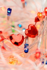 The figure in the form of a red heart on the background of garlands