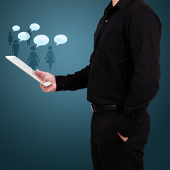 Businessman hand showing social networking technology on tablet.