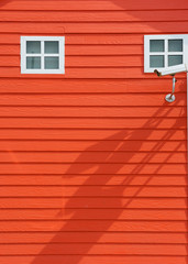 surveillance Cameras on red wall background