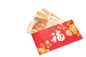 Hung Bao or Red packet with Good Fortune character contains Hong Kong Dollar notes