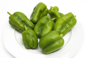 Green peppers on white background