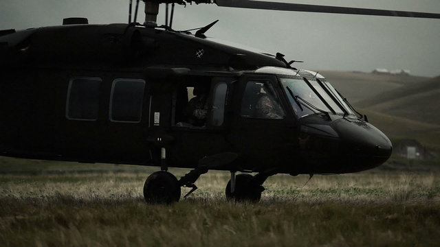 Shot from field of Black Hawk taking off.