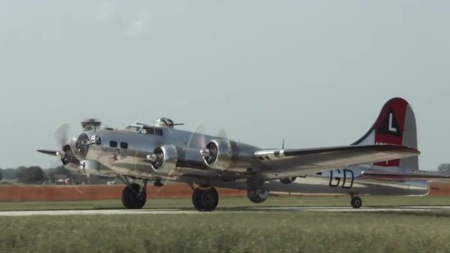 B-17 Flying Fortress, World War II bomber taxis through shot.  Mute. Recorded in 4K, ultra high definition.