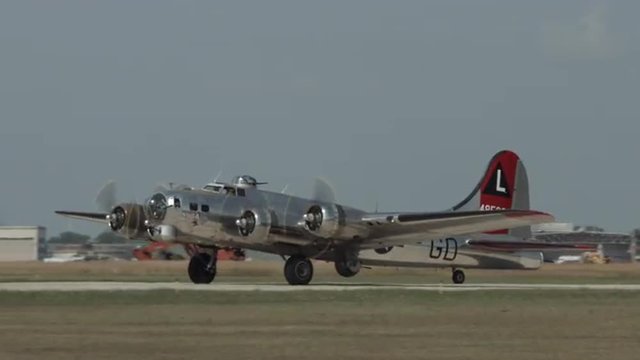 B-17 Flying Fortress, World War II bomber taxis at airfield.  Mute. Recorded in 4K, ultra high definition.