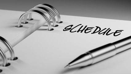 Closeup of a personal agenda setting an important date writing w