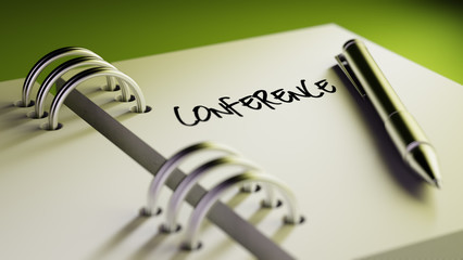 Closeup of a personal agenda setting an important date writing w