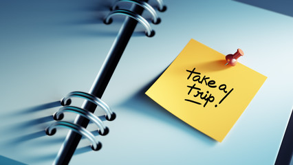 Closeup Yellow Sticky Note paste it in a notebook setting an app