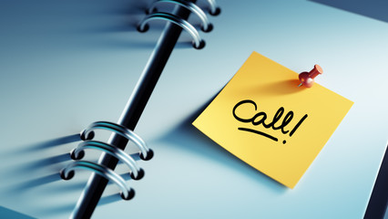 Closeup Yellow Sticky Note paste it in a notebook setting an app