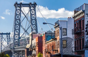 Fotobehang Brooklyn street scene with block of buildings near the Williamsb © deberarr