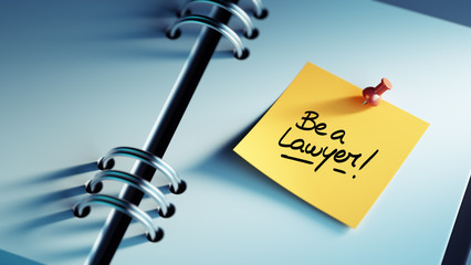 Obraz premium Closeup Yellow Sticky Note paste it in a notebook setting an app