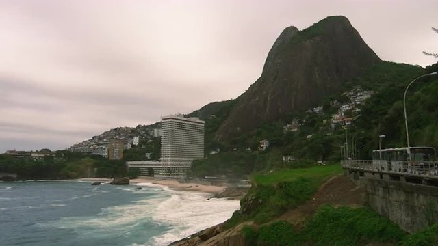 Slow motion panning shot of Sugarloaf Mountain and the coastline at Rio de Janeiro, Brazil