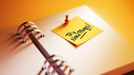 Closeup Yellow Sticky Note paste it in a notebook setting an app