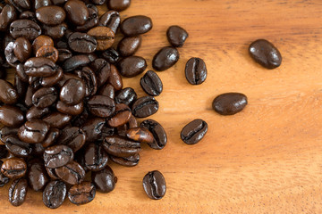Coffee beans on wood background