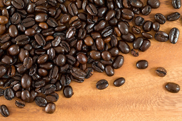 Coffee beans on wood background