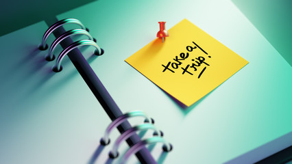 Closeup Yellow Sticky Note paste it in a notebook setting an app