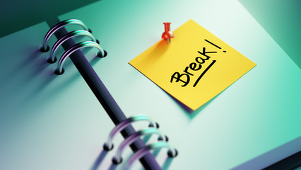 Closeup Yellow Sticky Note paste it in a notebook setting an app