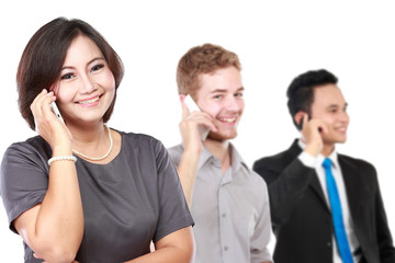 happy mature business women talking on the phone, with her staff
