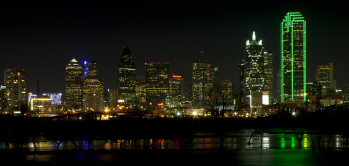 Downtown Dallas, Texas at night with the Trinity River in the foreground