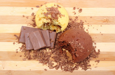 Fresh baked muffins, grated and portion of chocolate