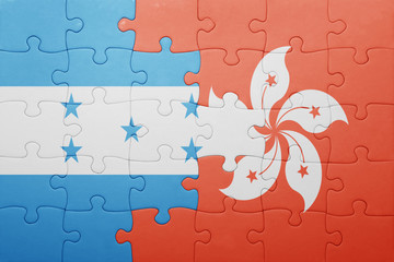 puzzle with the national flag of honduras and hong kong