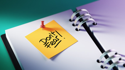 Closeup Yellow Sticky Note paste it in a notebook setting an app