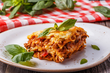 Traditional lasagna made with minced beef bolognese sauce - obrazy, fototapety, plakaty